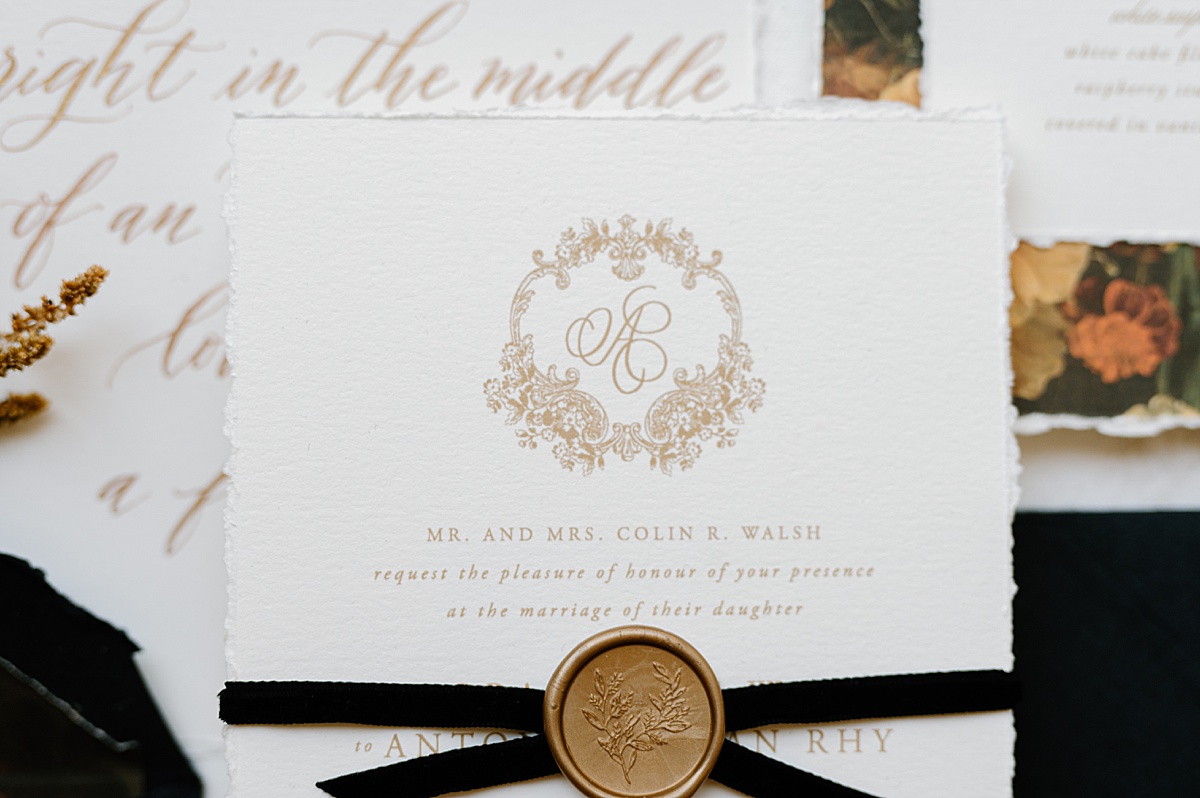Elegant black and gold wedding stationery